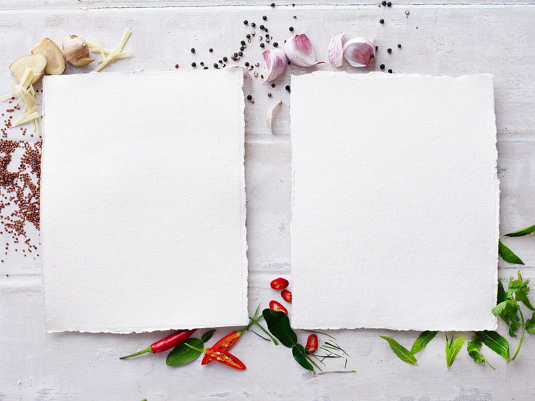Two sheets of blank paper on herbs and spices