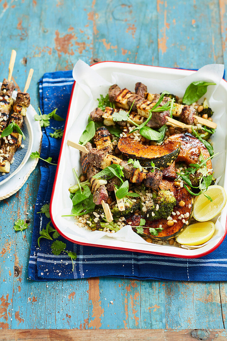 Lamb and haloumi skewers with roast vegetable and barley salad