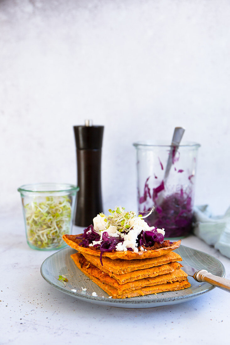 Carrot flatbread with red cabbage salad, feta and radish sprouts
