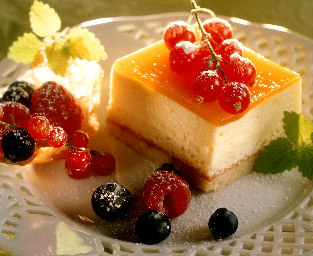 Quark slice with fresh berries on a plate
