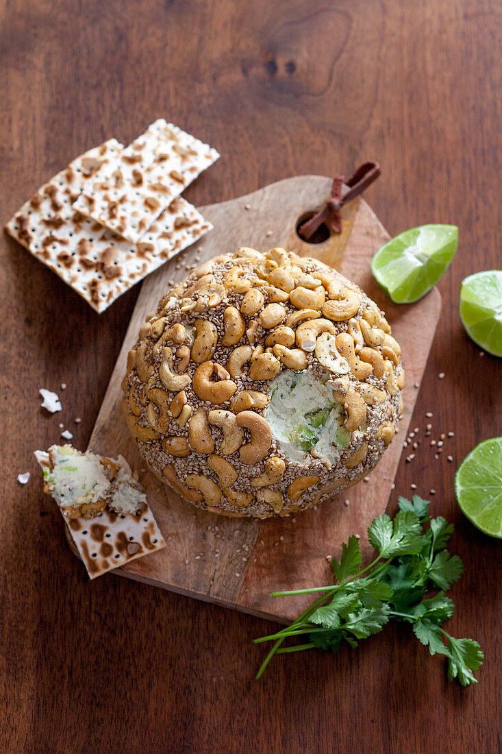 Cheese ball with avocado, cashew nuts and sesame