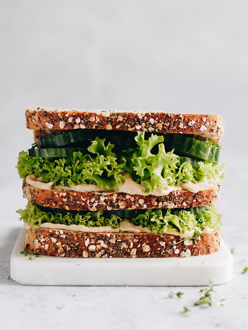 Wholegrain bread with hummus, lettuce, cucumber and cress