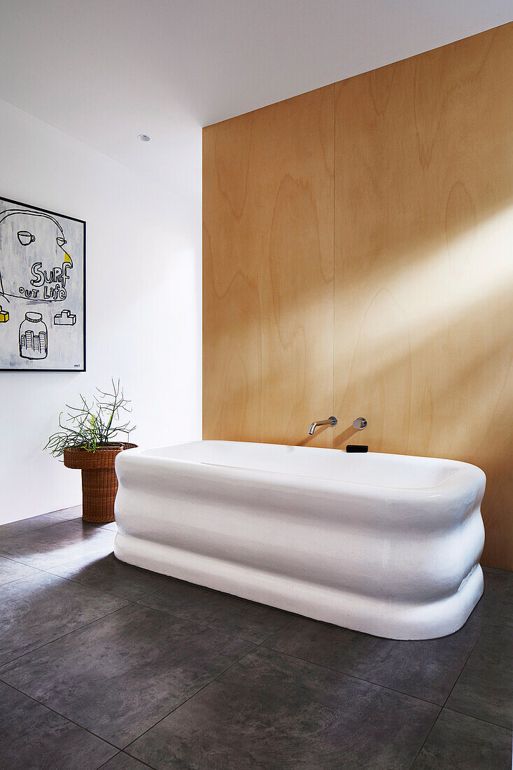 Corrugated bathtub in minimalist bathroom