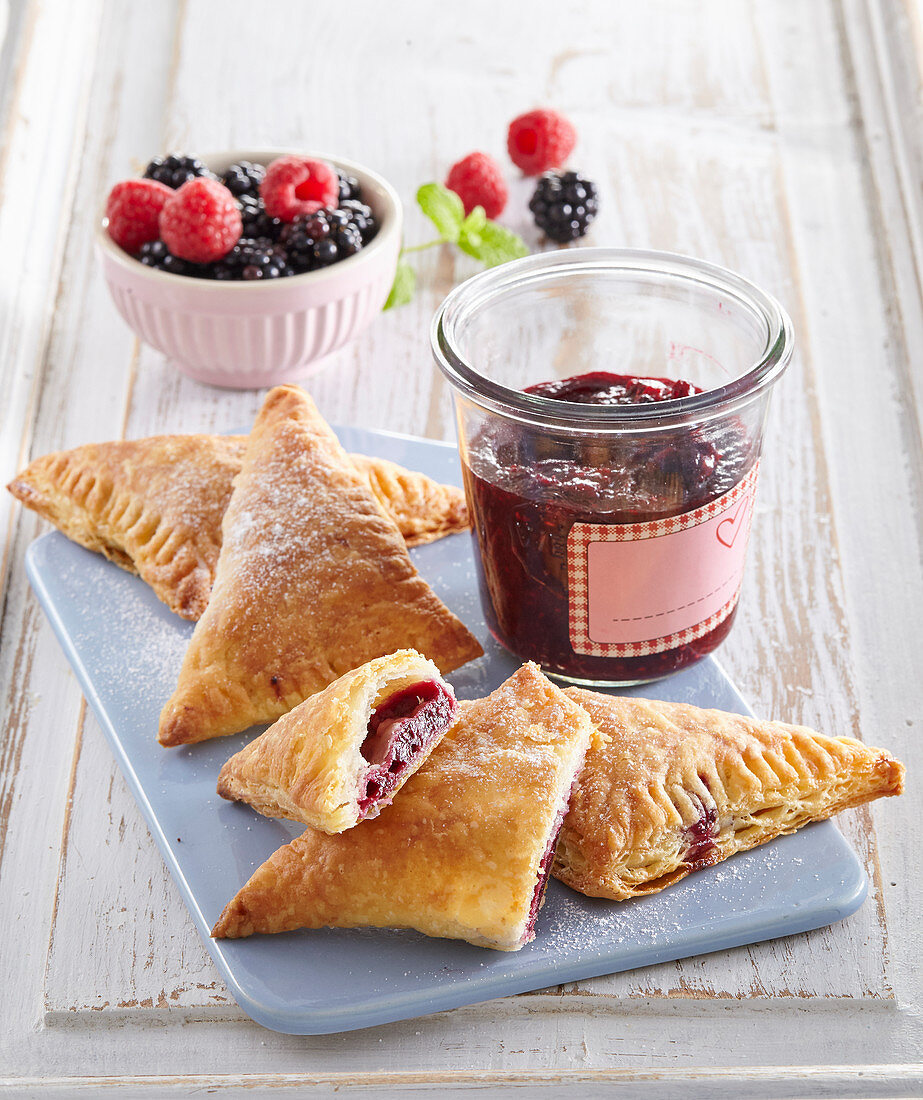 Custard pastries with forest berry jam