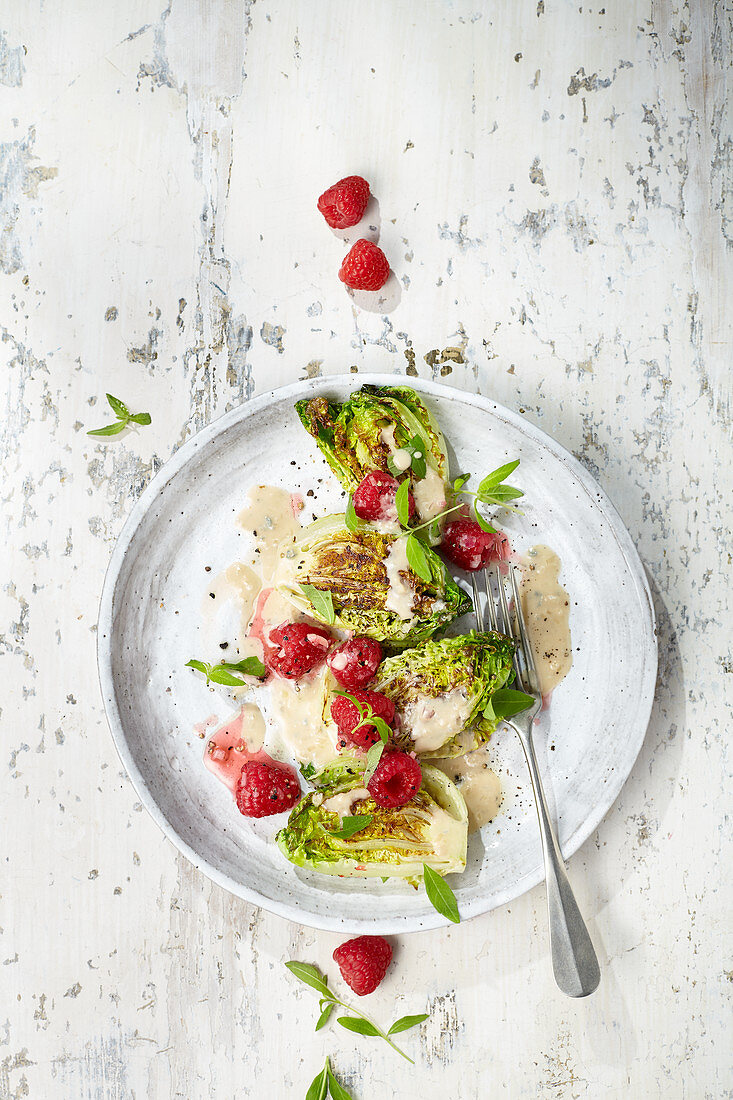 Fried lettuce hearts with raspberries and soy yogurt dressing