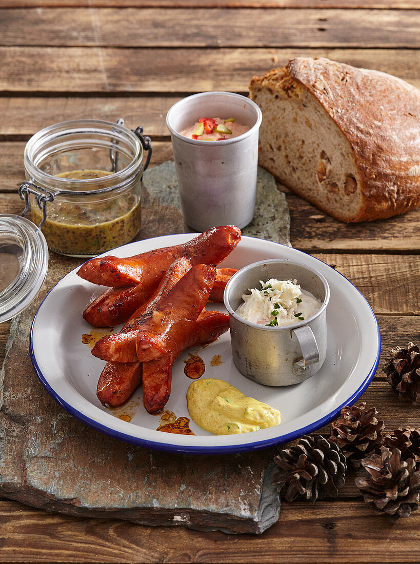 Marinated knackwurst with three dips