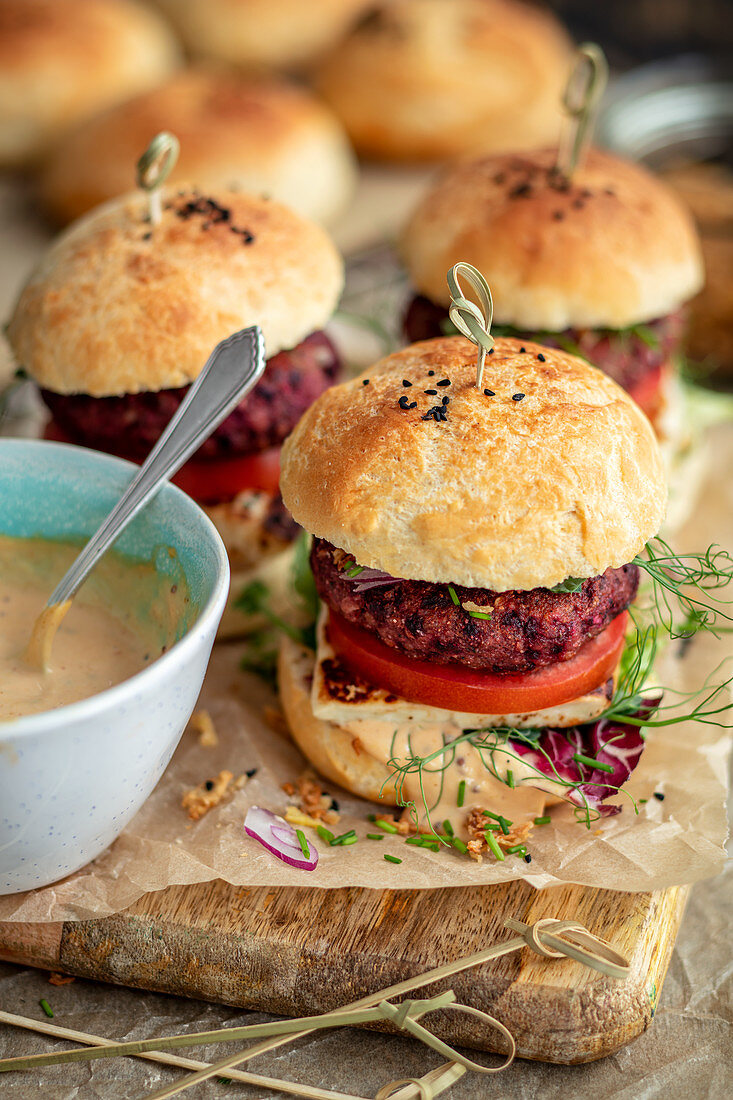 Homemade vegetarian burgers with beetroot patty and halloumi