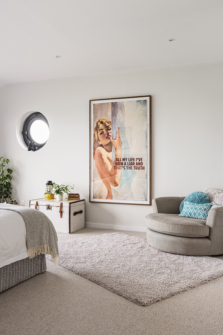 Large framed poster in 1960s style bedroom .