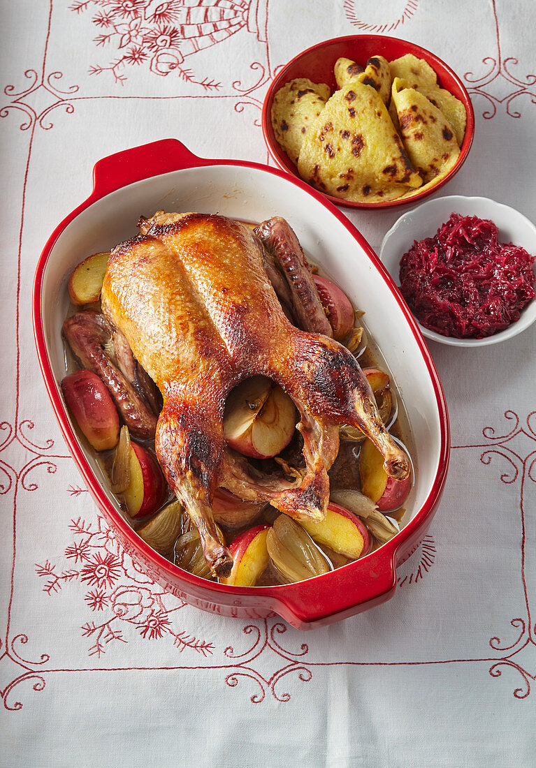 Baked honey duck with apples and potato pancakes