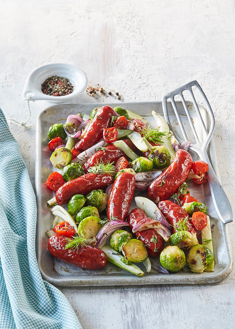 Baked sausages with Brussels sprout