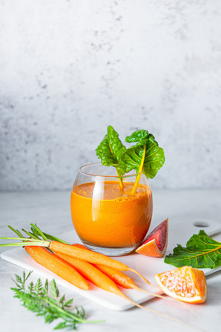 Carrot, orange and grapefruit juice with rainbow chard