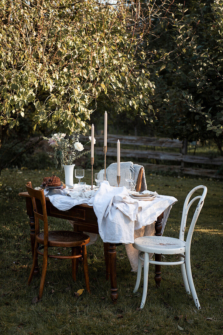 Festively set table in the late summer garden