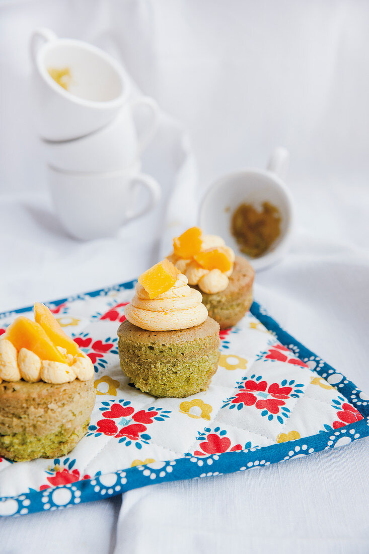 Matcha cupcakes with mango topping