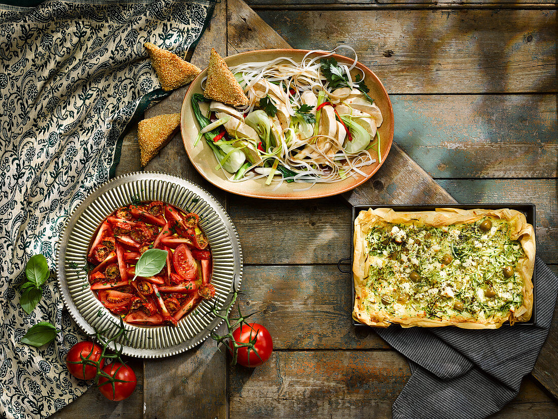 Asian poached chicken, courgette feta and olive filo tart, tomato salad