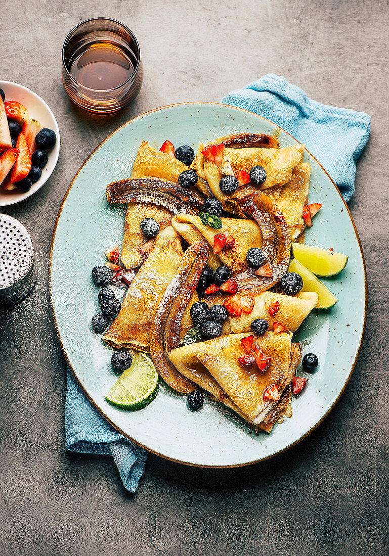 Pancakes with summer berries and bananas