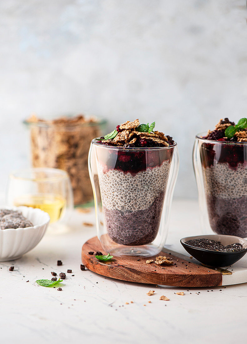 Chia pudding with berries, wholemeal cornflakes and cocoa nibs