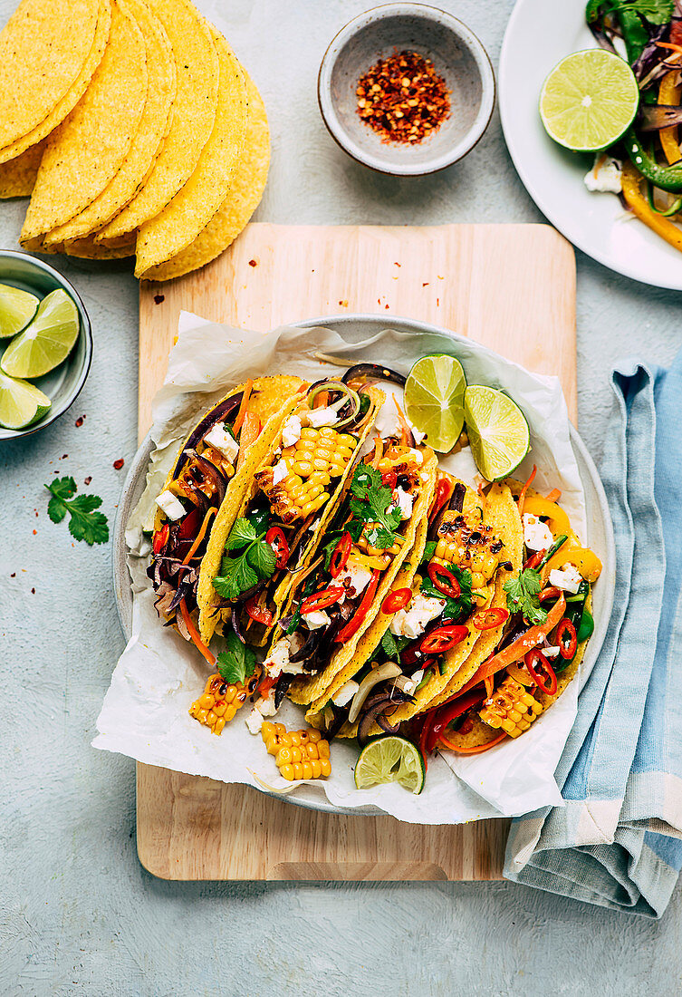 Colourful tacos with vegetables, chilli and lime