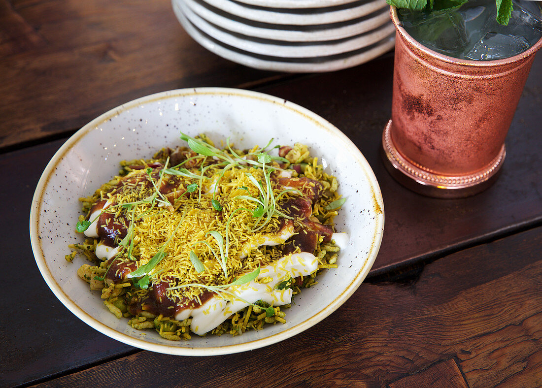Bhel pourri - snacks made from puffed rice, vegetables and tamarind sauce