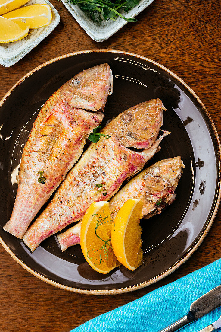 Grilled fish with herbs and lemon