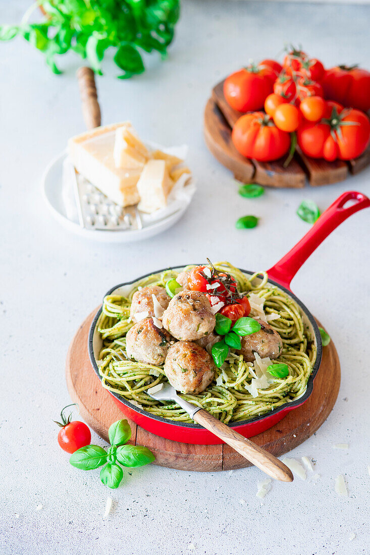 Pasta with pesto and meatballs