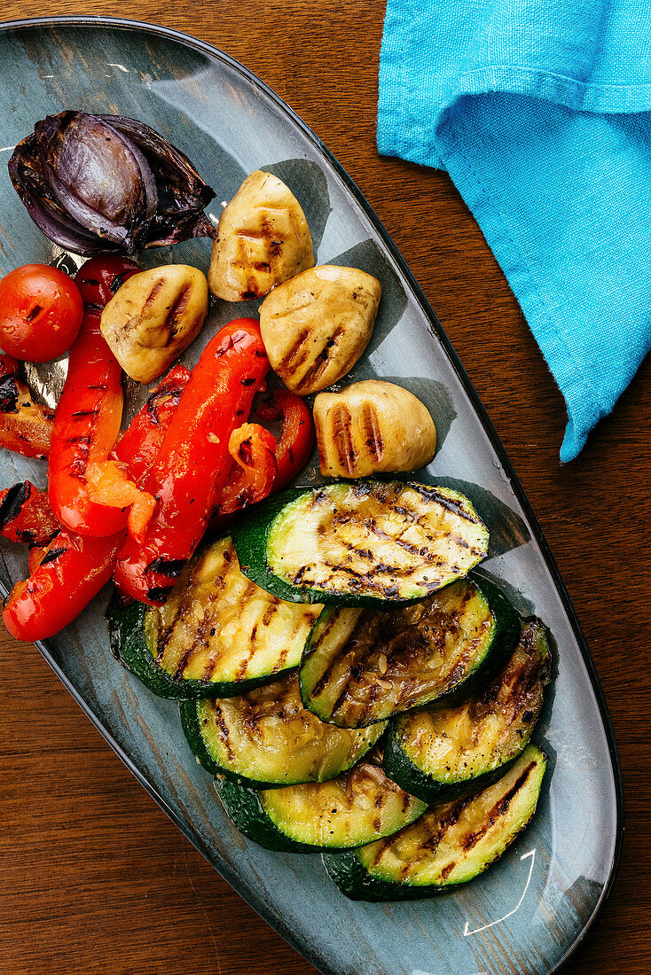 Grilled vegetables onion, tomato and zucchini