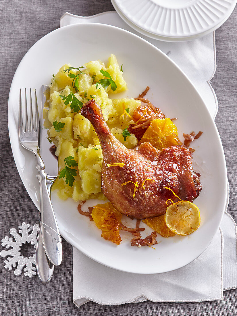 Ginger and orange duck legs with potatoes