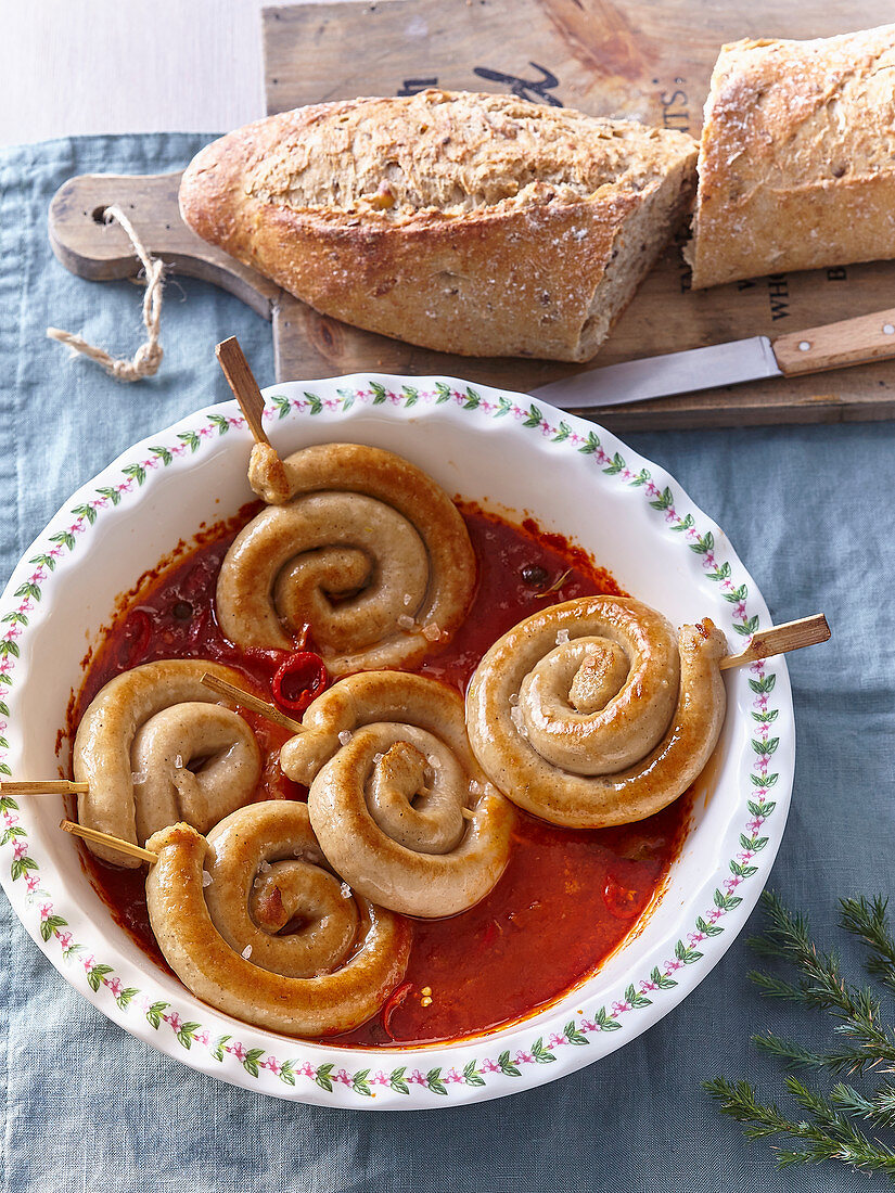 Roast sausage spirals in chilli sauce