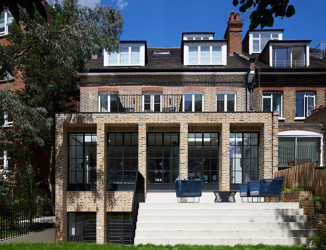 Classic brick house with lattice windows and terrace