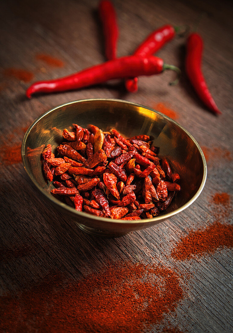 Dried red chillies in a brass bowl