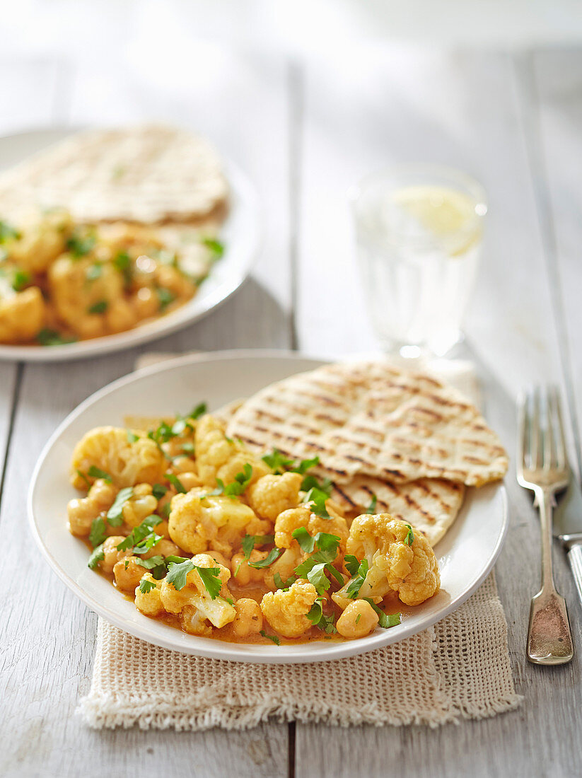 Satay cauliflower and chickpea curry with storecupboard flatbreads