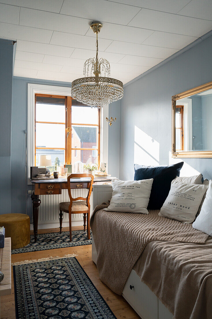 Classic guest room with antique desk by a window