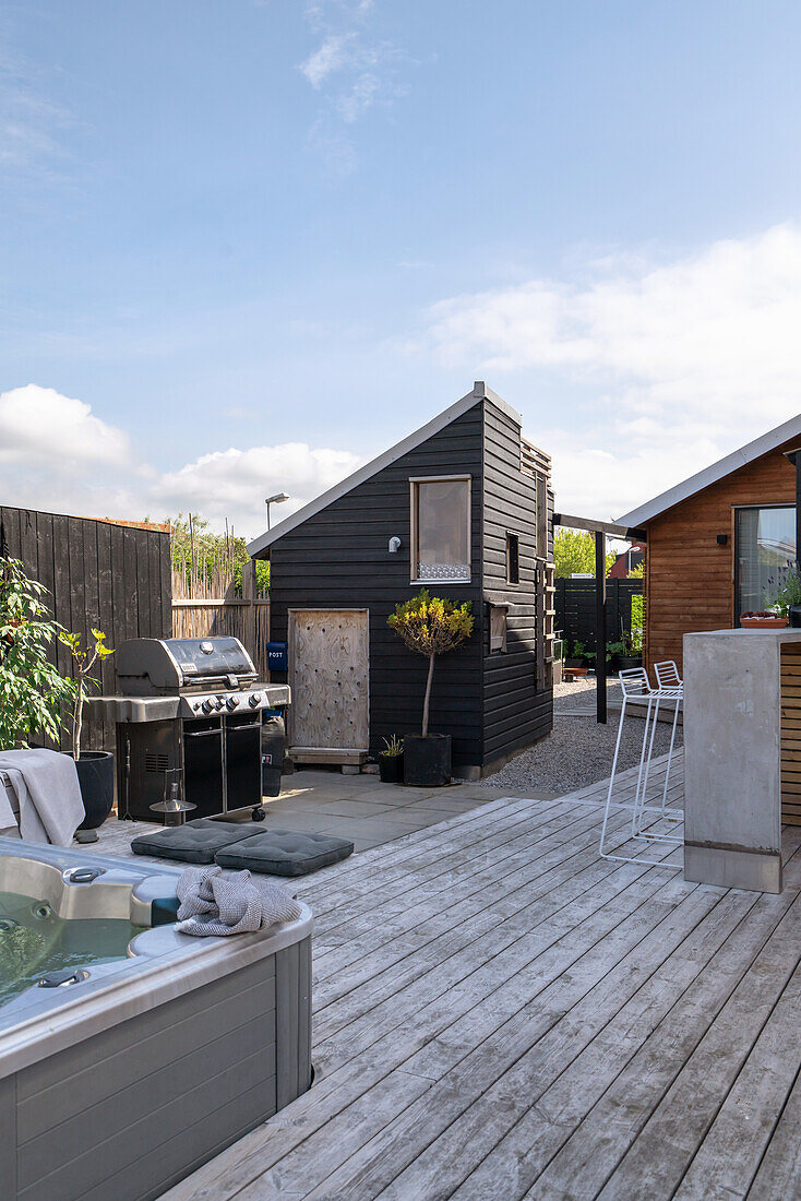 Modern outdoor area with terrace, whirlpool and bar