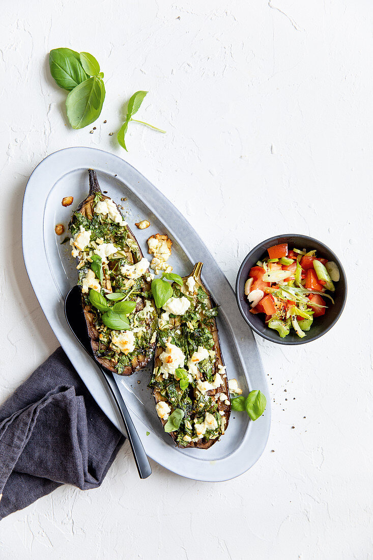 Gratinated aubergines with feta cheese and a tomato salad