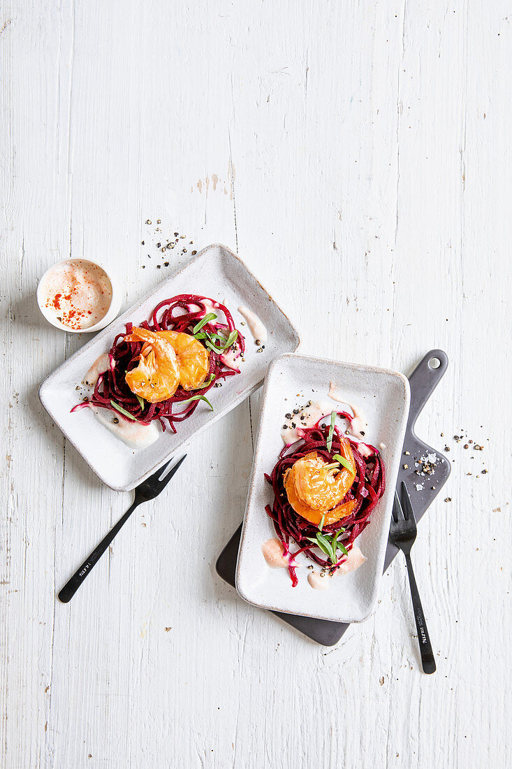 Beetroot spaghetti with king prawns