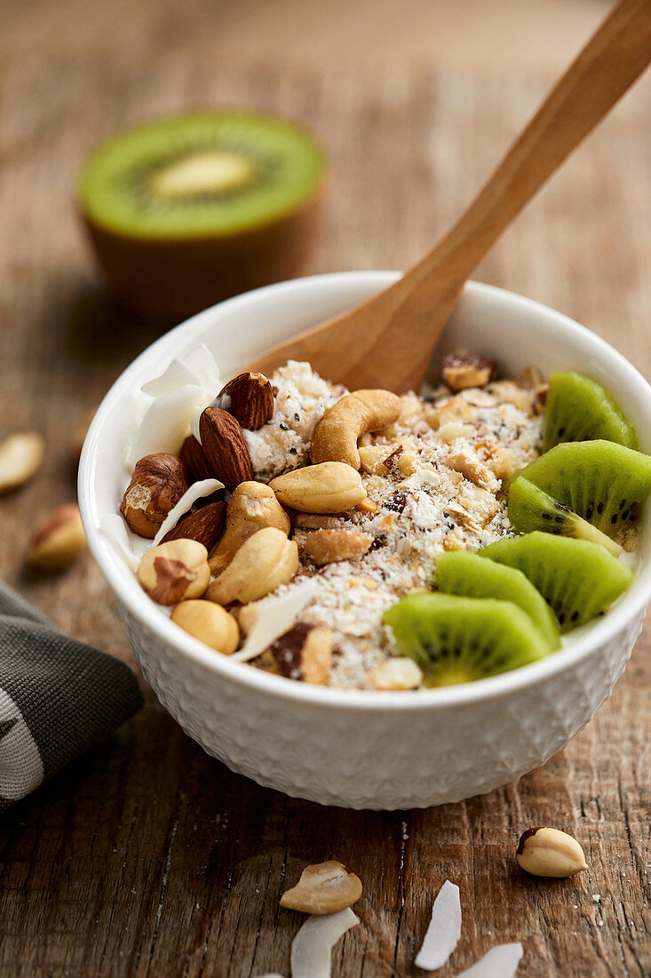 Low carb granola breakfast with fresh fruits, yogurt and nuts