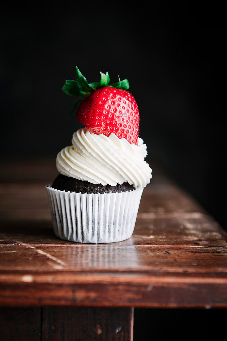 Chocolate cupcake with mascarpone frosting and strawberry