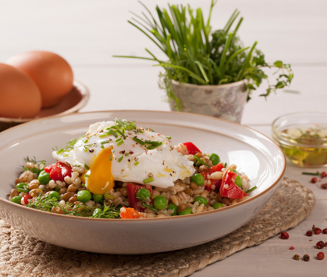Poached egg on a grain salad with vegetables
