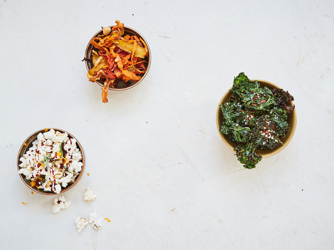 Kale and chilli crisps, carrot crisps and orange and rosemary popcorn