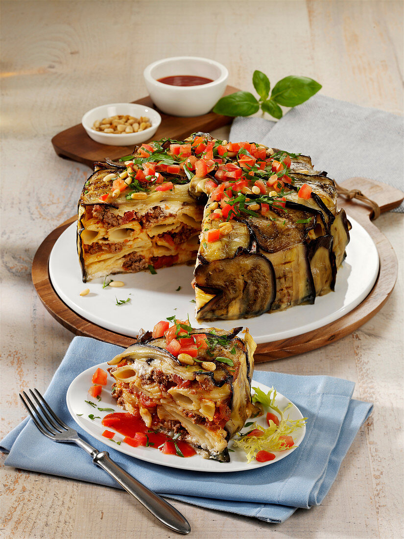 Oven-baked pasta and minced meat cake with grilled aubergines