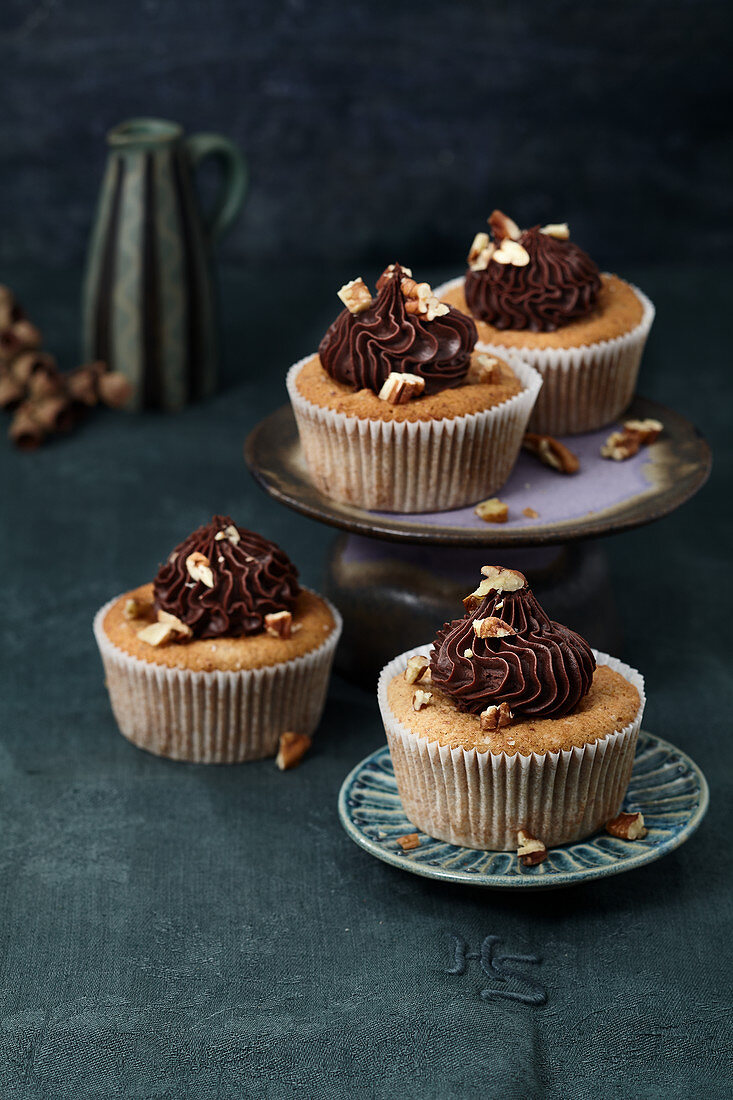Pecan nut and banana muffins with chocolate and peanut cream