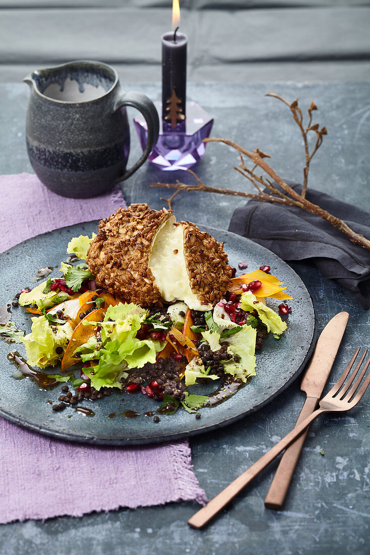 Camembert in a crispy nut crust on a beluga lentil and chicory salad