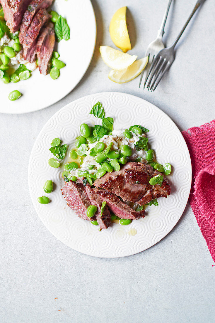 Greek lamb with smoked aubergine and minty broad beans