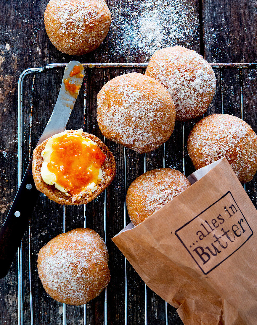 Bread rolls with butter and apricot jam