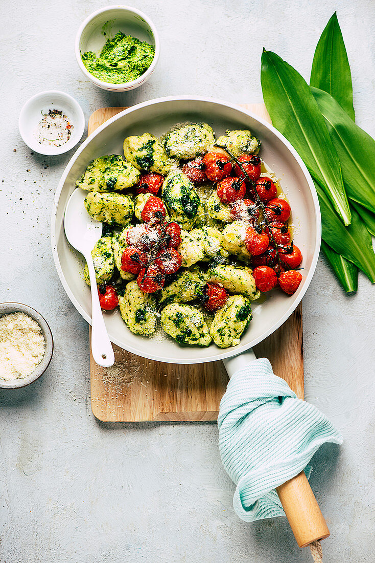 Delicate gnocchi in wild garlic butter with oven-roasted tomatoes