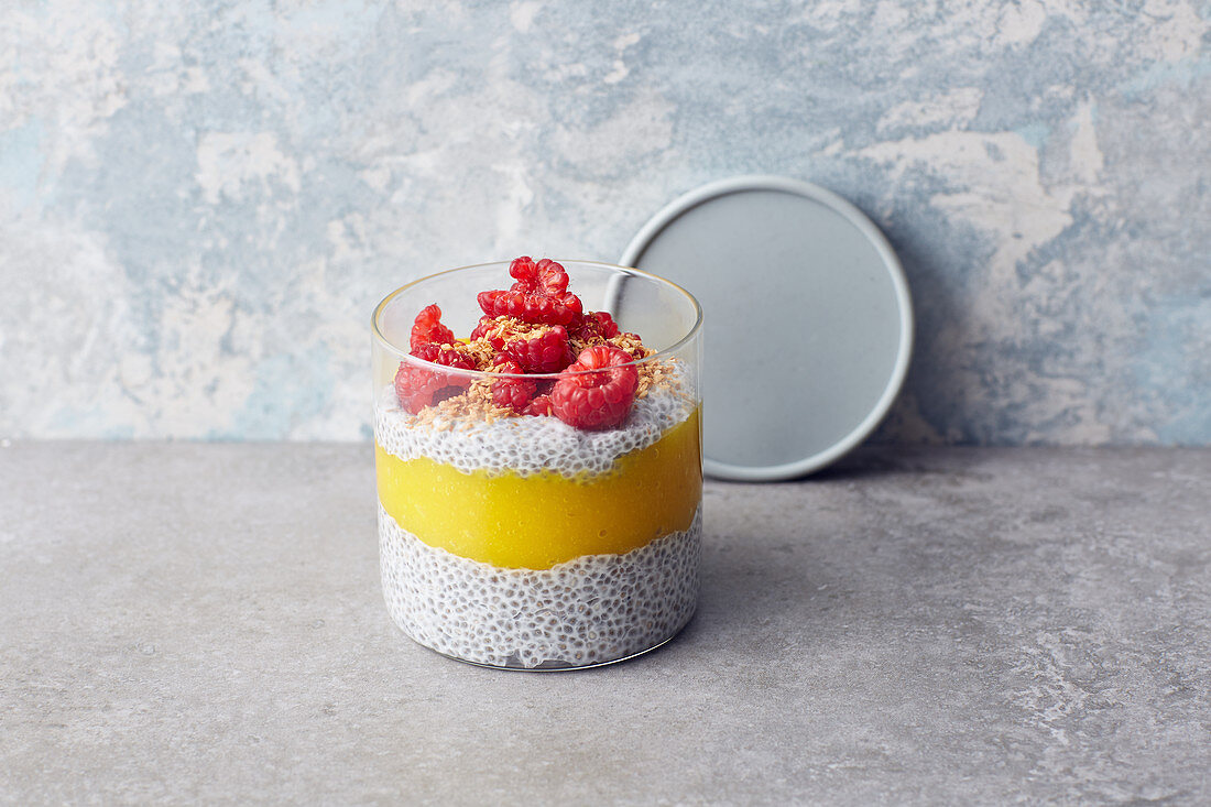 Chia pudding with coconut milk, mango and raspberries
