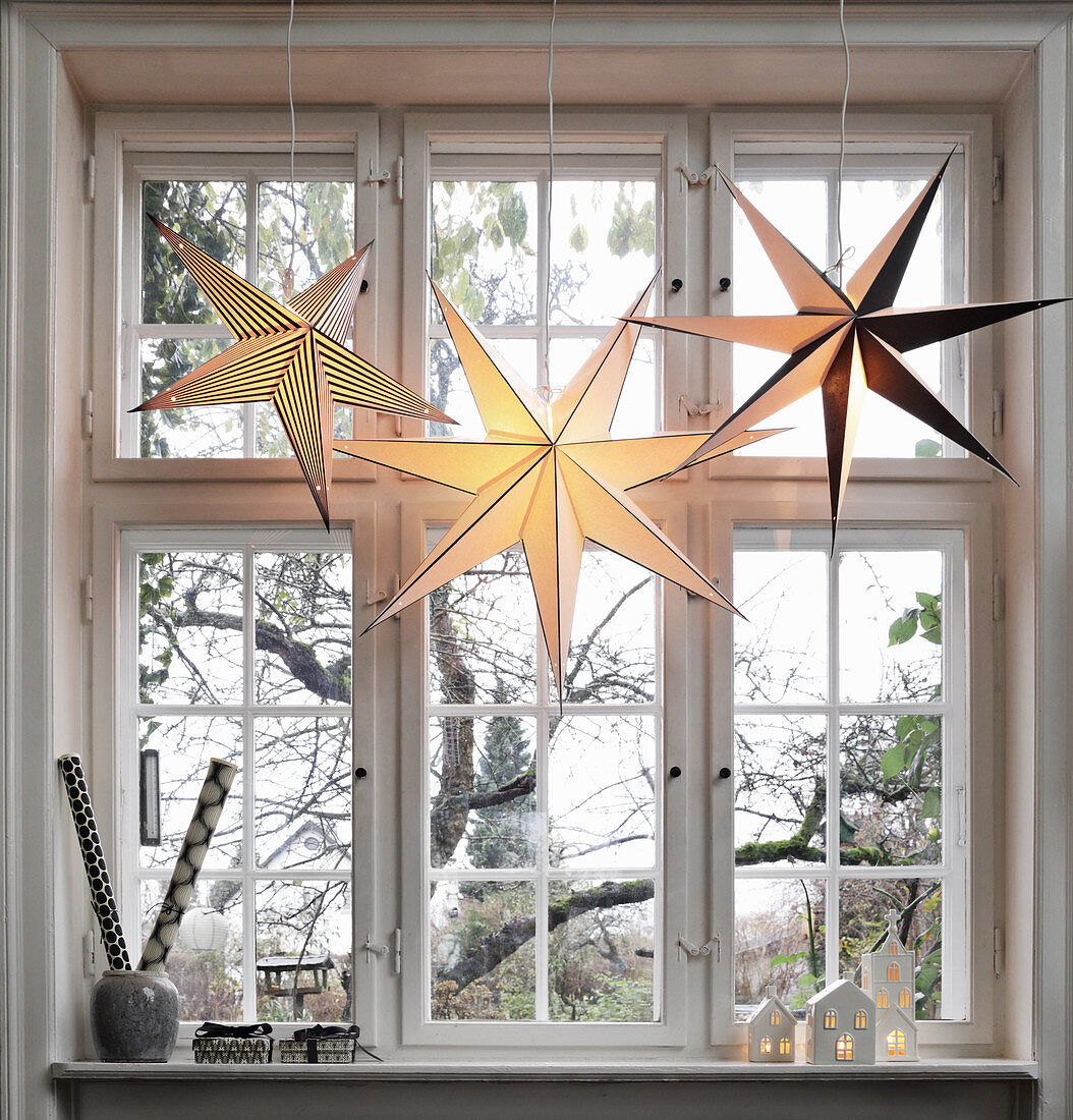 Paper Christmas stars in window