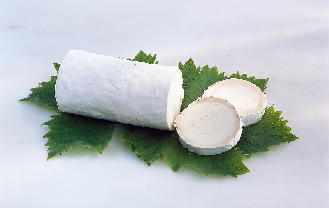 Goat cheese roll on a grape leaf