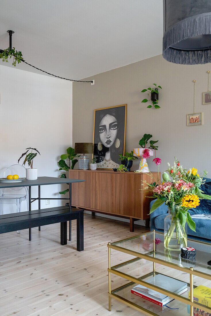 Living room with dining area, sideboard, and glass coffee table