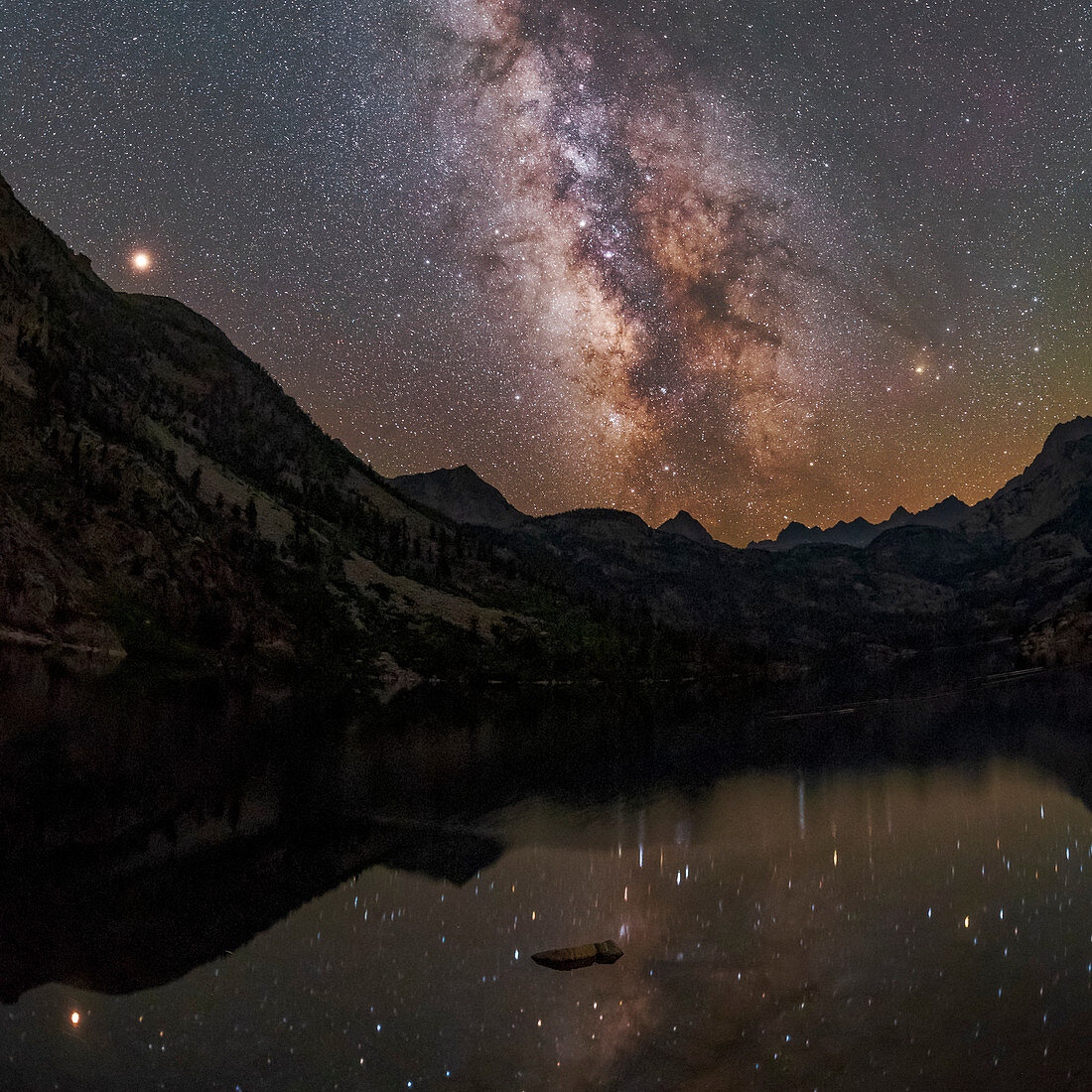 Milky Way and Mars over a mountain lake