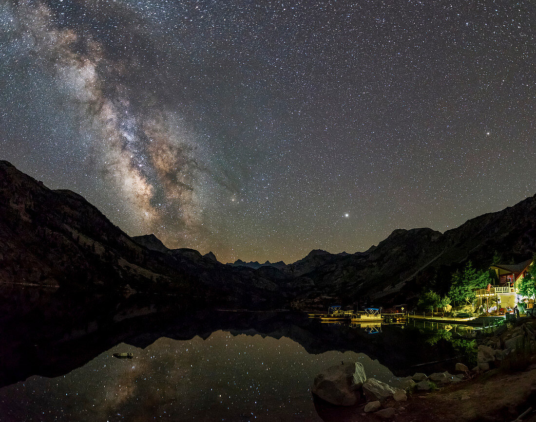 Milky Way and Jupiter over a mountain lake